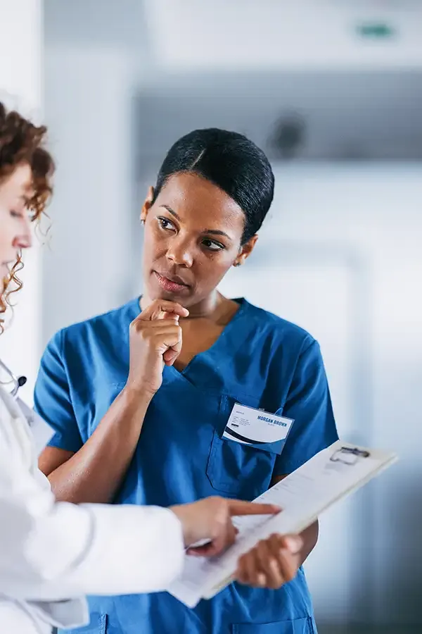 Healthcare professional focused during a patient consultation